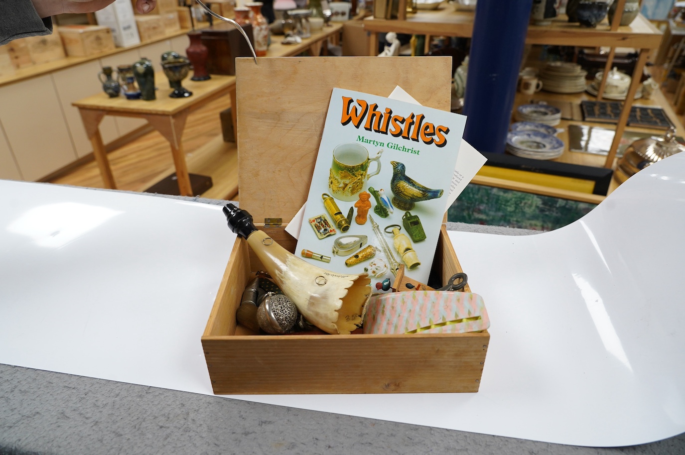 A collection of whistles including a horn example, a tin whistle, novelty bird whistles, etc. Condition - fair